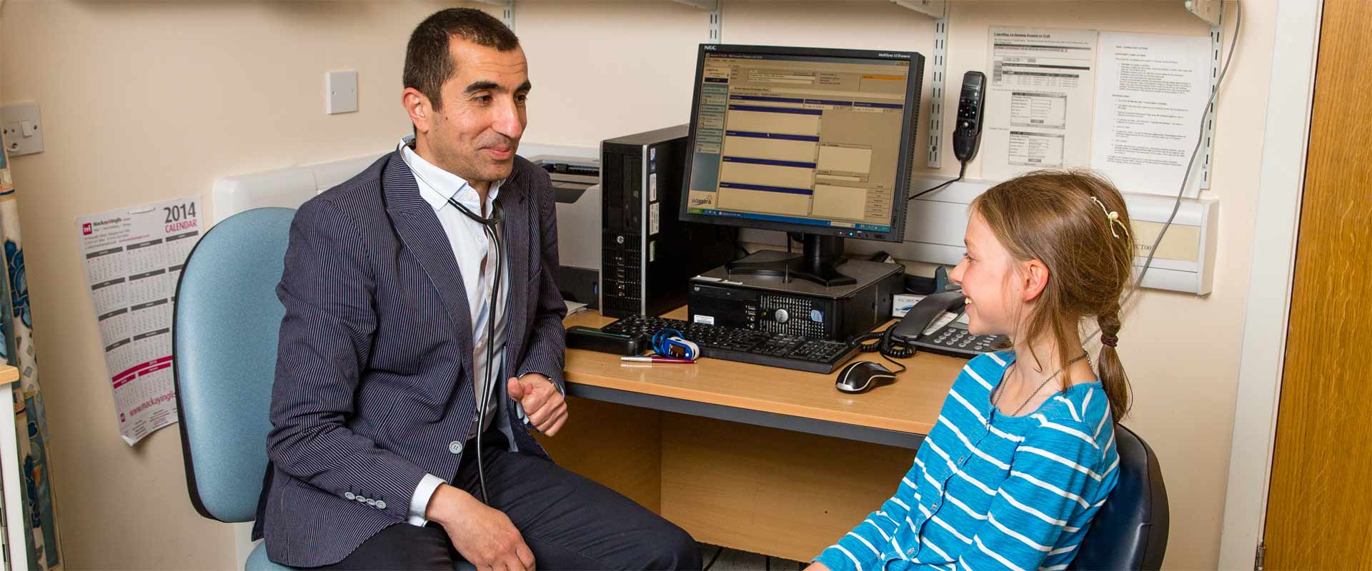 Doctor speaking to young patient